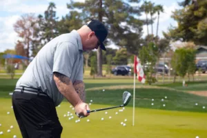 A golf student performing swing