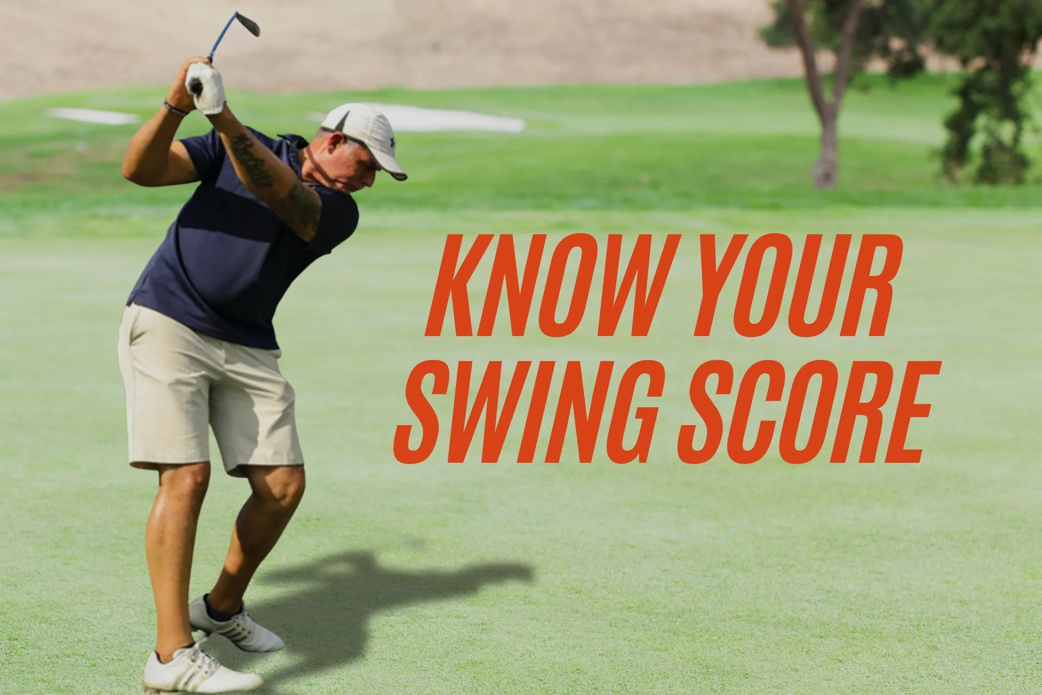 A male golfer in a dark blue polo, light shorts, and white cap takes a backswing on a sunny green golf course. Bold orange text on the image reads &ldquo;KNOW YOUR SWING SCORE.